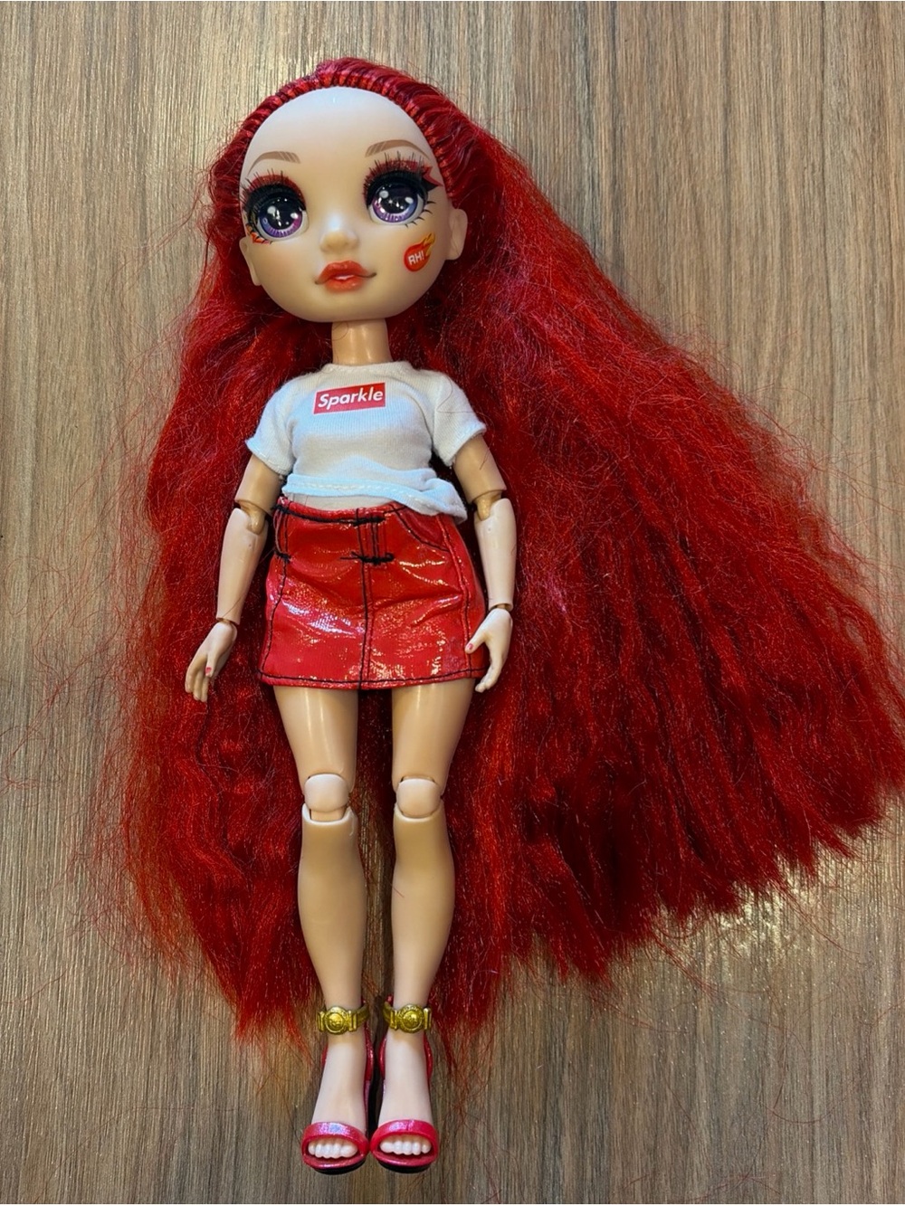 Rainbow High Ruby Anderson doll with sparkle shirt leather skirt red heels